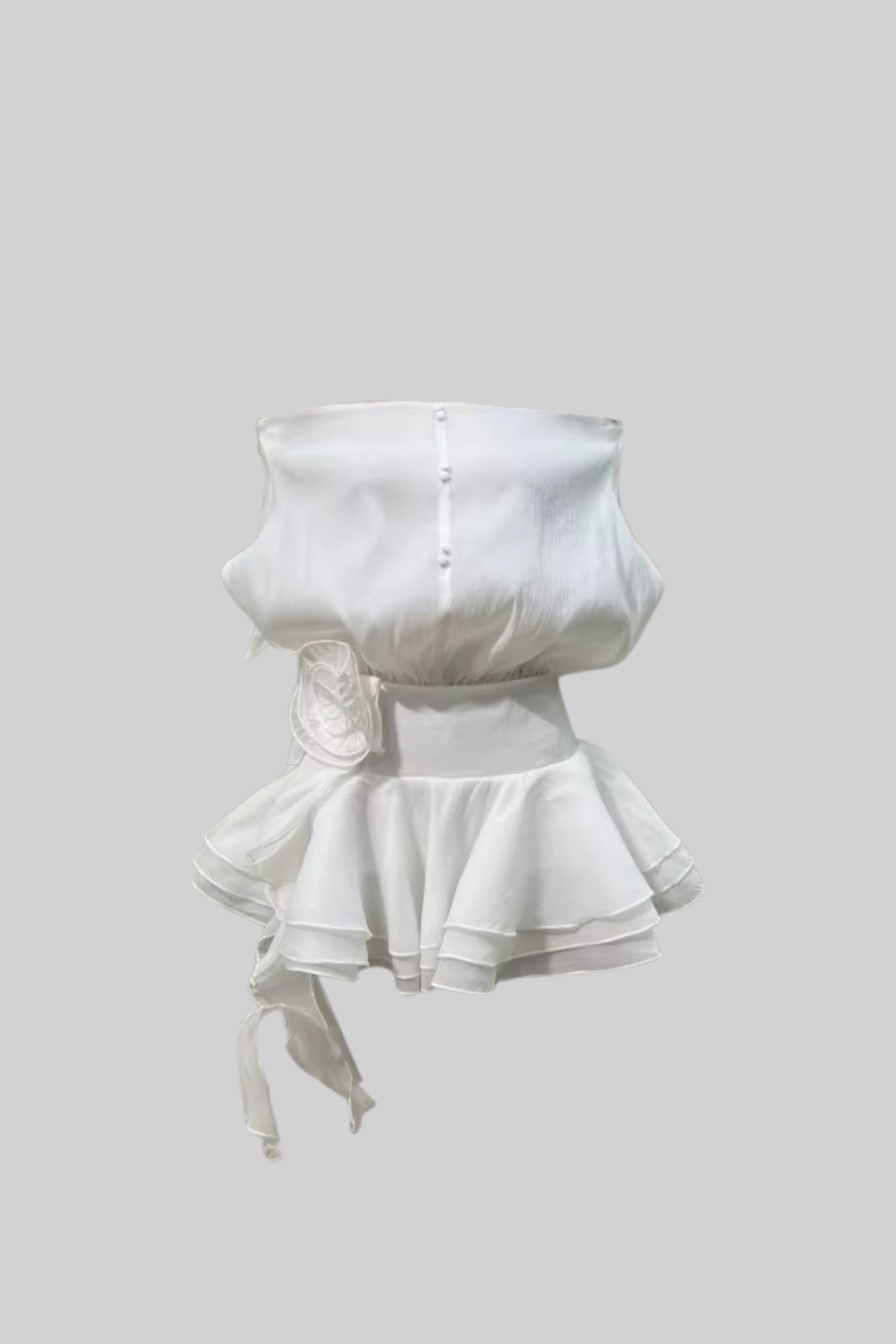 Elegant Mini Dress With Peplum Hem And Rosette Waist Embellishment - White