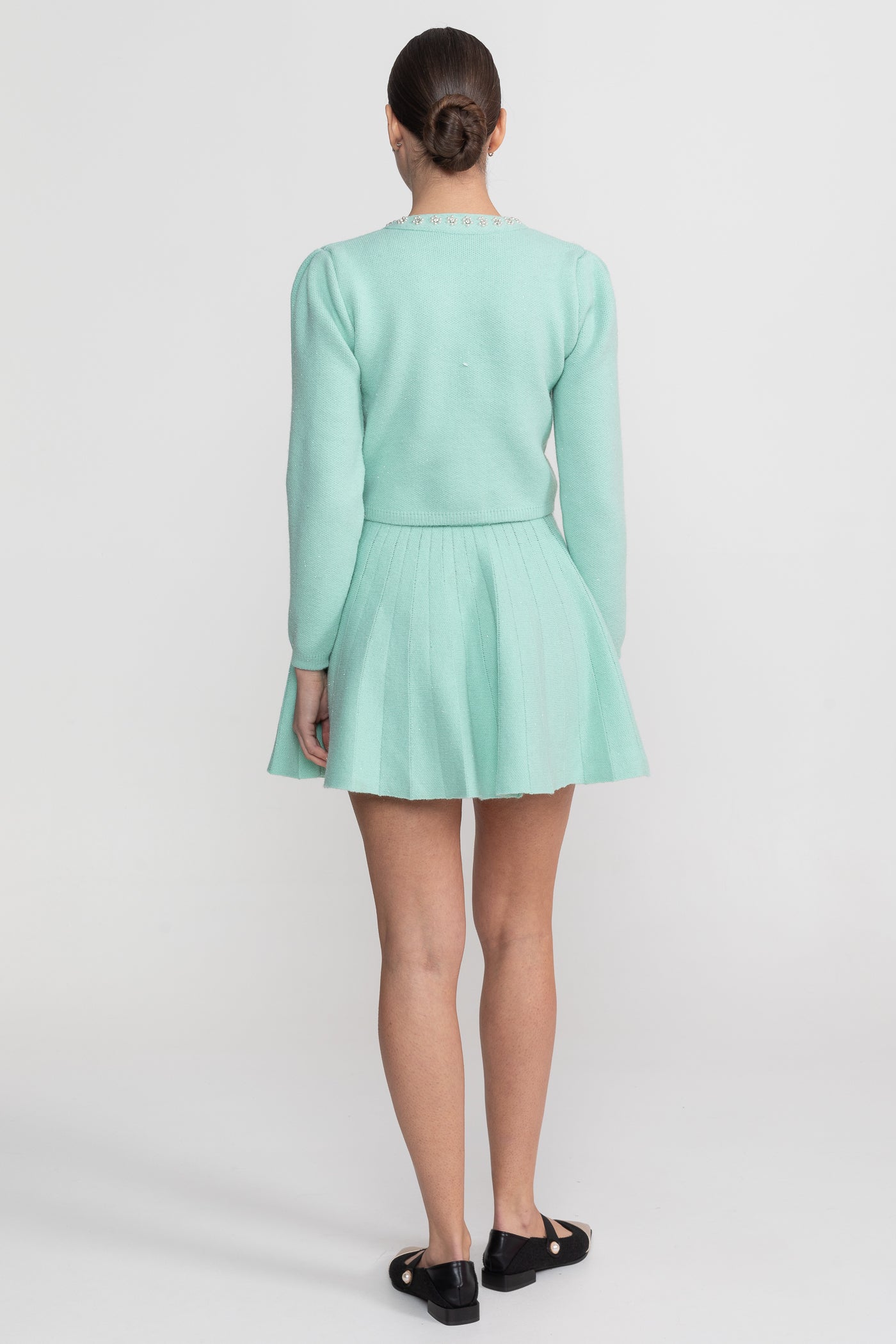 طقم منسوج متناسق مع كارديغان بأكمام طويلة وتنورة ميني متطابقة - بلون teal 